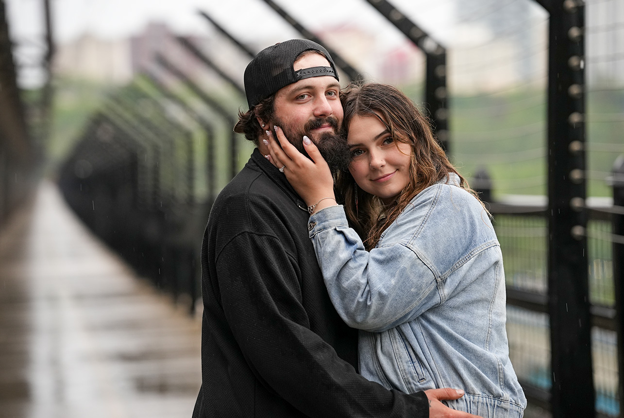 Couple embraces in a quiet moment on Edmonton’s High Level Bridge