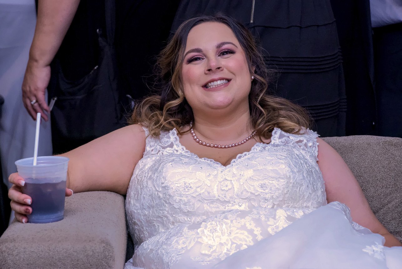 Smiling-Bride-sitting-with-a-drink-Edmonton